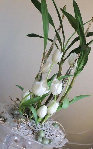 Wax fruit, glue nest, orchid plant and tulips