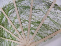 Weaving with tufts of grass
