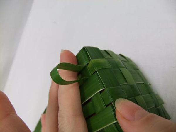 Cut the leaves at an angle and weave it through on itself to create a neat overlap