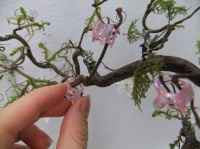 Butterfly hairclip claws to hold twigs in place while glue dries