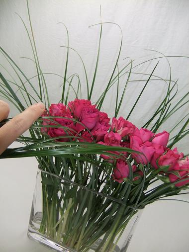 Comb the grass with your hand in the direction the french braid will be. Comb the grass with your hand in the direction the french braid will be.