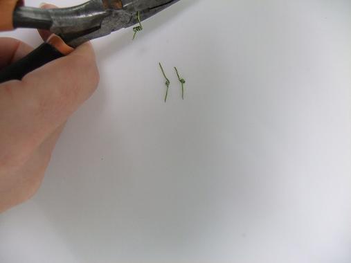 Cut the wire between the coils at a sharp angle.