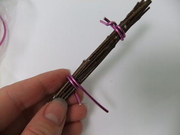 Wrap the wire around the twigs to create a second band.