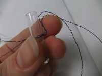 Wire spider legs for tiny glass test tubes