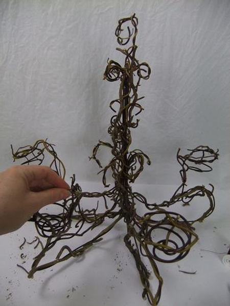 Let these twigs dry on the wire structure before adding the fresh plant material.