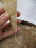 Bark and paper covered Styrofoam stand for ice cream cones