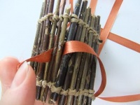 Weaving ribbon through a twig structure
