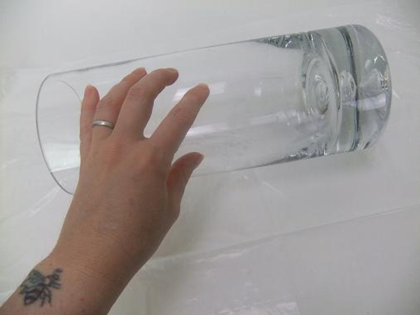 Set a vase on its side on a plastic lined working surface.