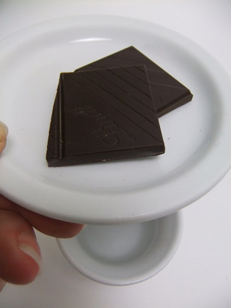 Place the chocolate on a small plate and set it over the steaming water