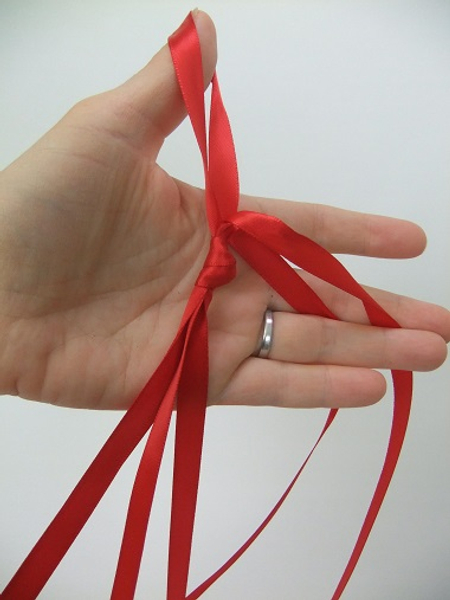 Knot the ribbon at the top to combine