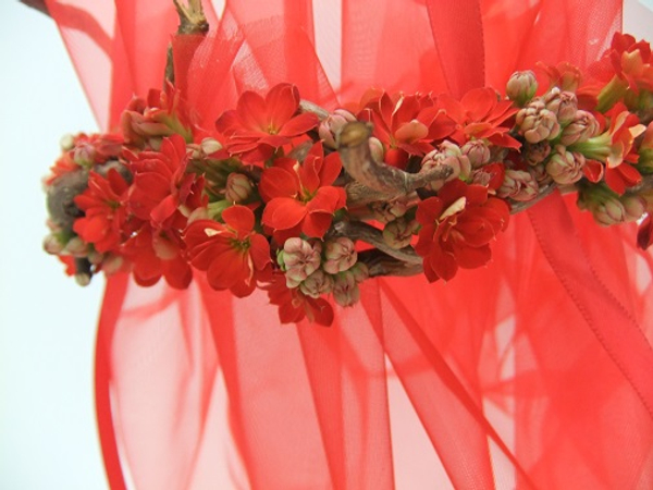 Red Kalanchoe and hazel twig flower girl net basket ready to fill with confetti or petals