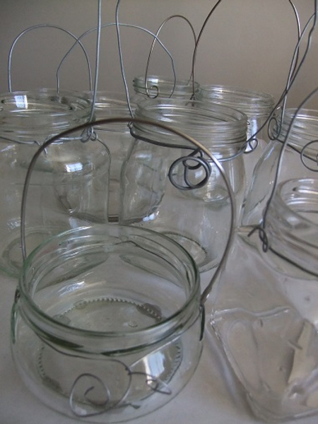 Add wire handles to recycled glass for a hanging container.