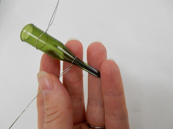 Wrap the second wire around the lower end of the tube and twist to secure