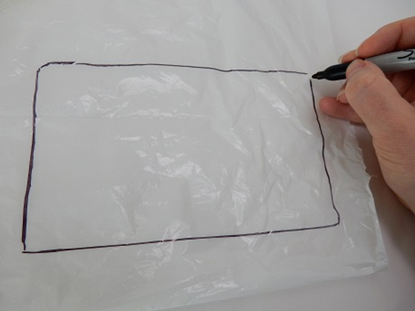 Draw a large rectangle on a plastic sheet