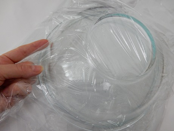Cover a round bowl with cling wrap
