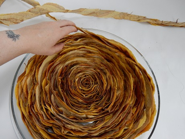 Fill the entire container so that it is tight and will dry in this coiled shape