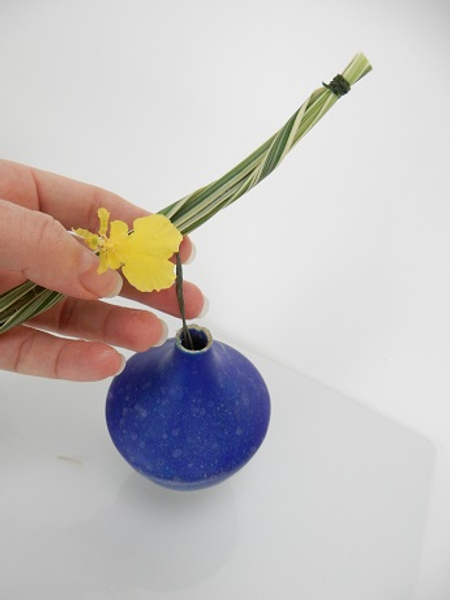 Slip the wires into the neck of the vase