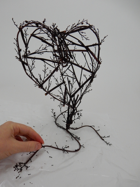 Add a few delicate twigs to the base
