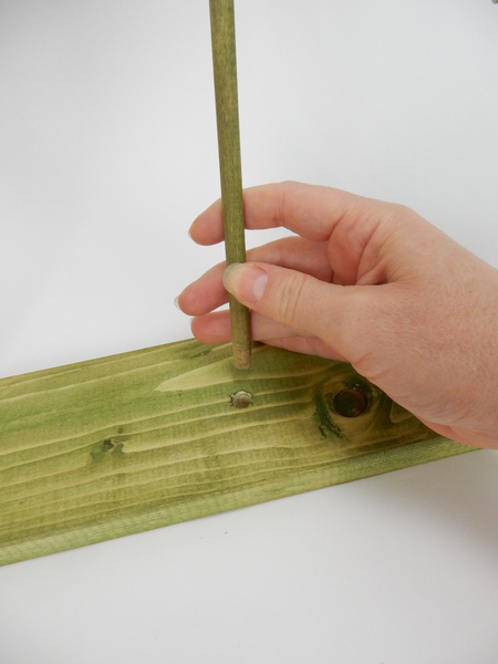 Fit the dowel sticks into the hole when the stain is dry