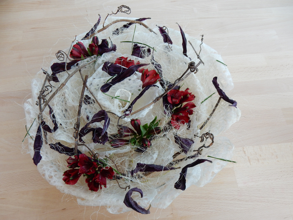 Grape vine tendrils, alstroemeria, and dried lily petals inj a Waski rose armature