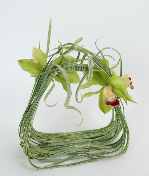 Cymbidium orchids and curled grass with crystals