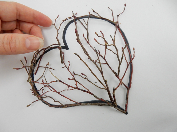 Follow the top curves and glue the twigs in place