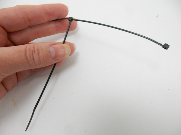 Simply slip one cable tie through another to the point where it just catch