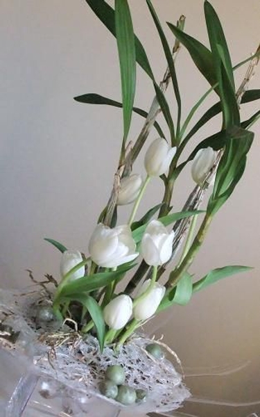Wax fruit, glue nest, orchid plant and tulips Wax fruit, glue nest, orchid plant and tulips