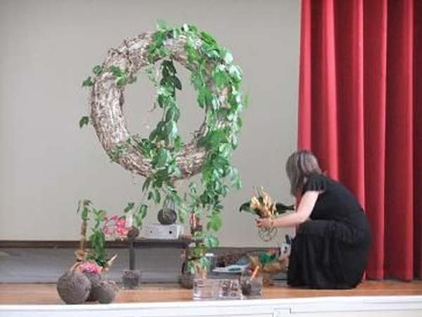 Placing the Orchid on wreath Placing the Orchid on wreath