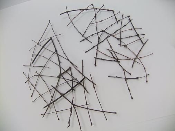 Glue the twigs into a round collar shape Glue the twigs into a round collar shape