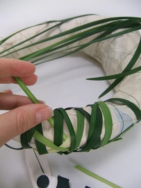 Looping the lily grass around the structure