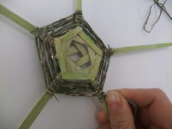 Continue the pattern with one third of the flax string Continue the pattern with one third of the flax string