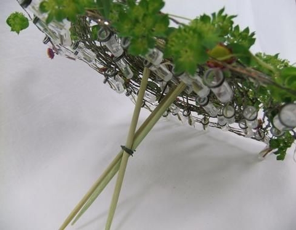 Parasol from the back to show the test tubes filled with water for the flower material