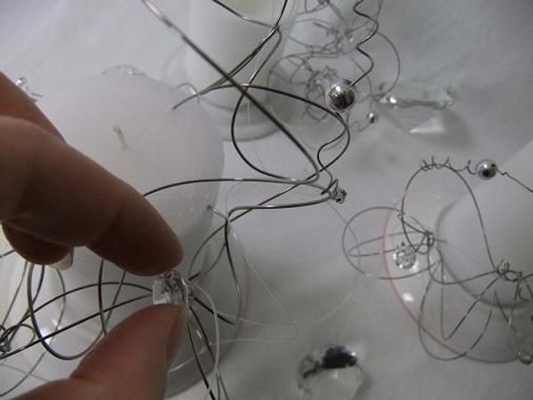 Decorate the trees with crystals, beads and a few strands of fishing line Decorate the trees with crystals, beads and a few strands of fishing line