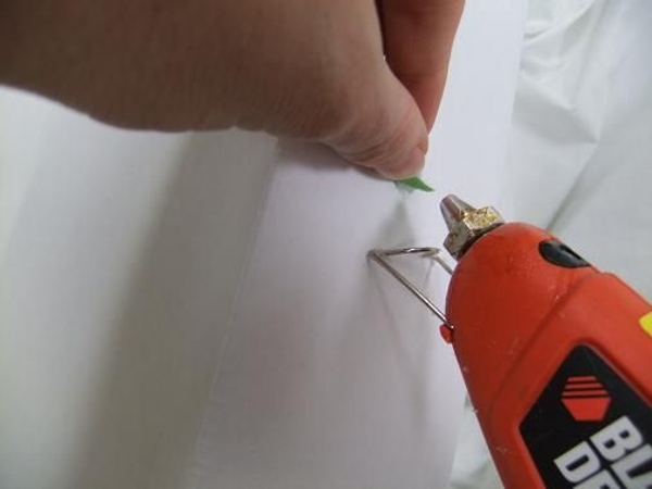 Glue the velcro section to the top of the door with hot glue