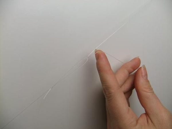 Loop the line through the knot and pull tight Loop the line through the knot and pull tight