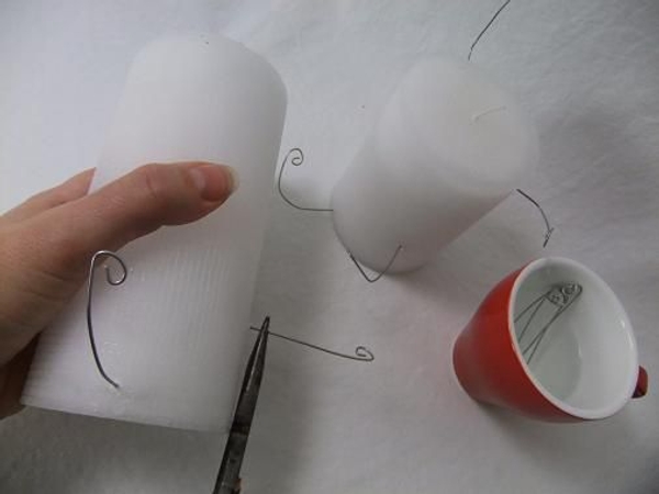 Turn the candle, now add the second wire a little higher into the candle Turn the candle, now add the second wire a little higher into the candle