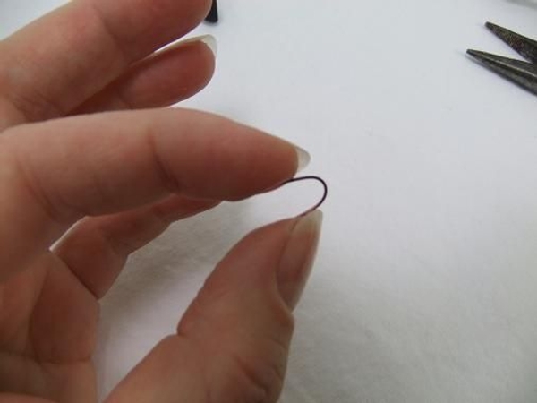 Bend a hairpin out of wire to secure the willow Bend a hairpin out of wire to secure the willow