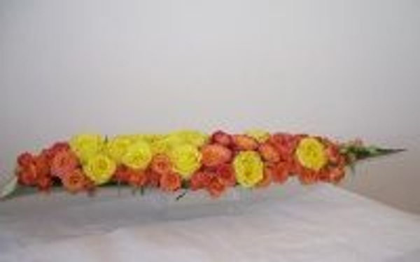 Floral Art Design using roses and Agave sisalana (sisal) boat.