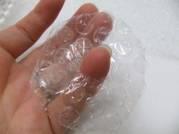 Cut a hole in the bubble wrap raft to fit the flower stem Cut a hole in the bubble wrap raft to fit the flower stem