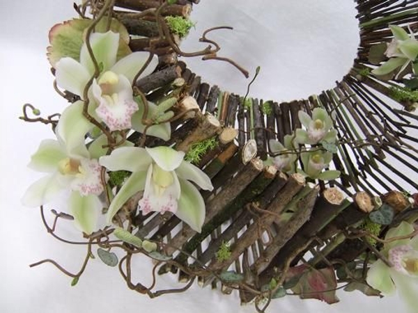Cymbidium orchids and hazel twigs dress the handbag Cymbidium orchids and hazel twigs dress the handbag