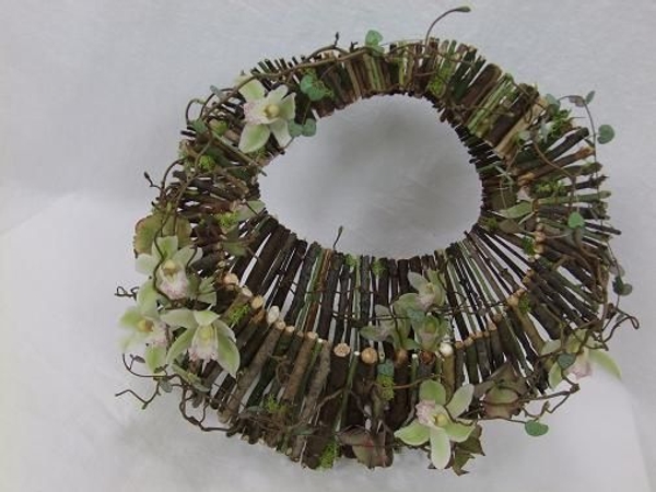 Cymbidium orchids, hydrangea, rosary vine ( Ceropegia woodii ), moss and hazel twig handbag Cymbidium orchids, hydrangea, rosary vine ( Ceropegia woodii ), moss and hazel twig handbag