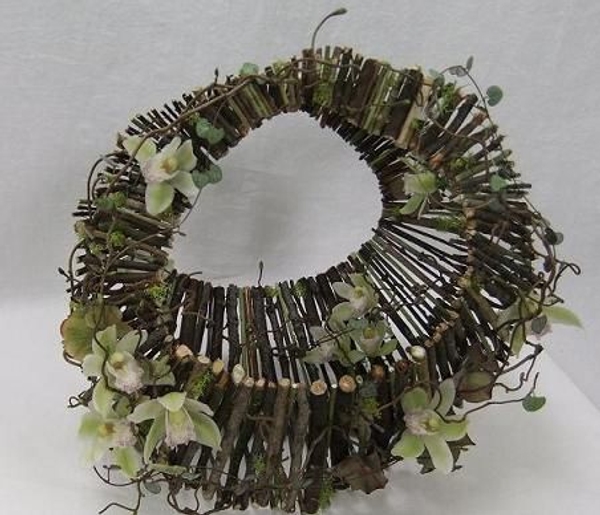 Moss covered twig handbag floral art design Moss covered twig handbag floral art design