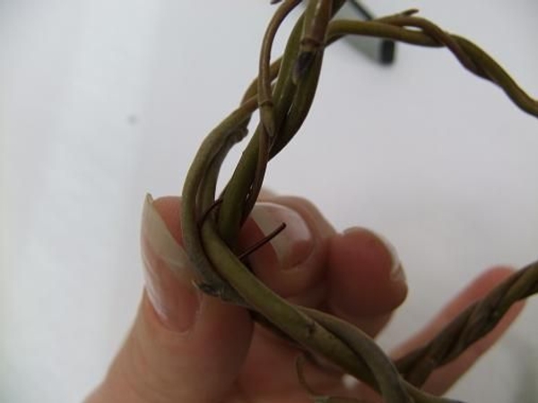 Slip the hairpin through and around the biggest willow pieces Slip the hairpin through and around the biggest willow pieces
