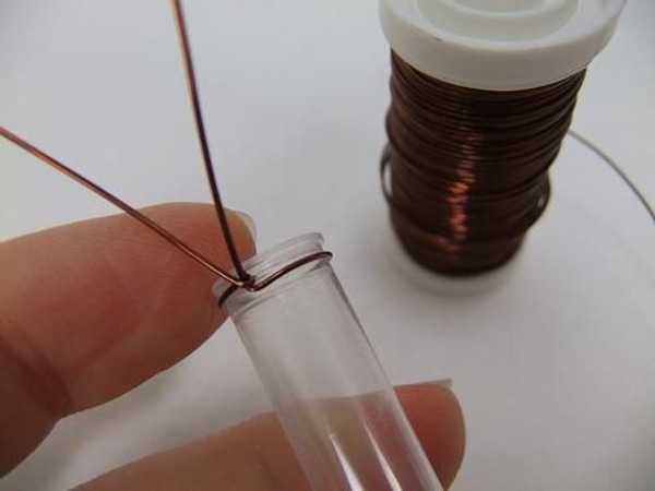 Secure the wire by twisting it around the test tube Secure the wire by twisting it around the test tube