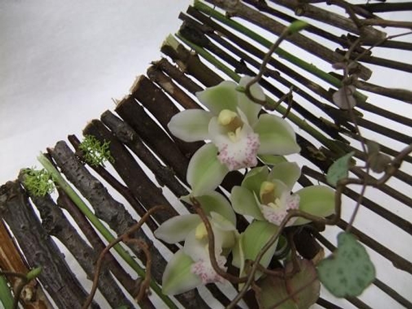 Wired twigs radiate out to make a basket handbag Wired twigs radiate out to make a basket handbag