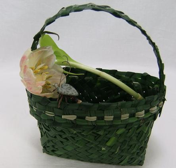 Tulip in a hand-woven green grass hand bag 