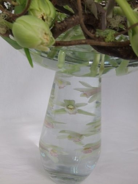Position orchids under water with a corsage magnet Position orchids under water with a corsage magnet
