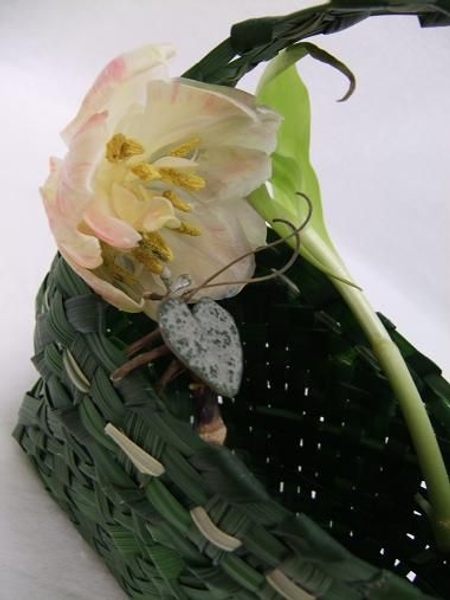 Tulip wrapped around the woven hand basket. Tulip wrapped around the woven hand basket.