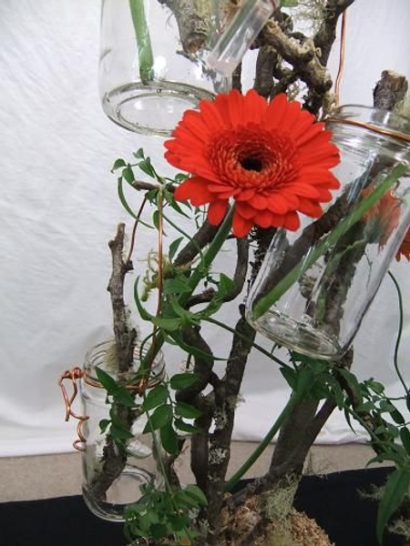 Hanging rustic copper and glass jars on the twig tree. Hanging rustic copper and glass jars on the twig tree.